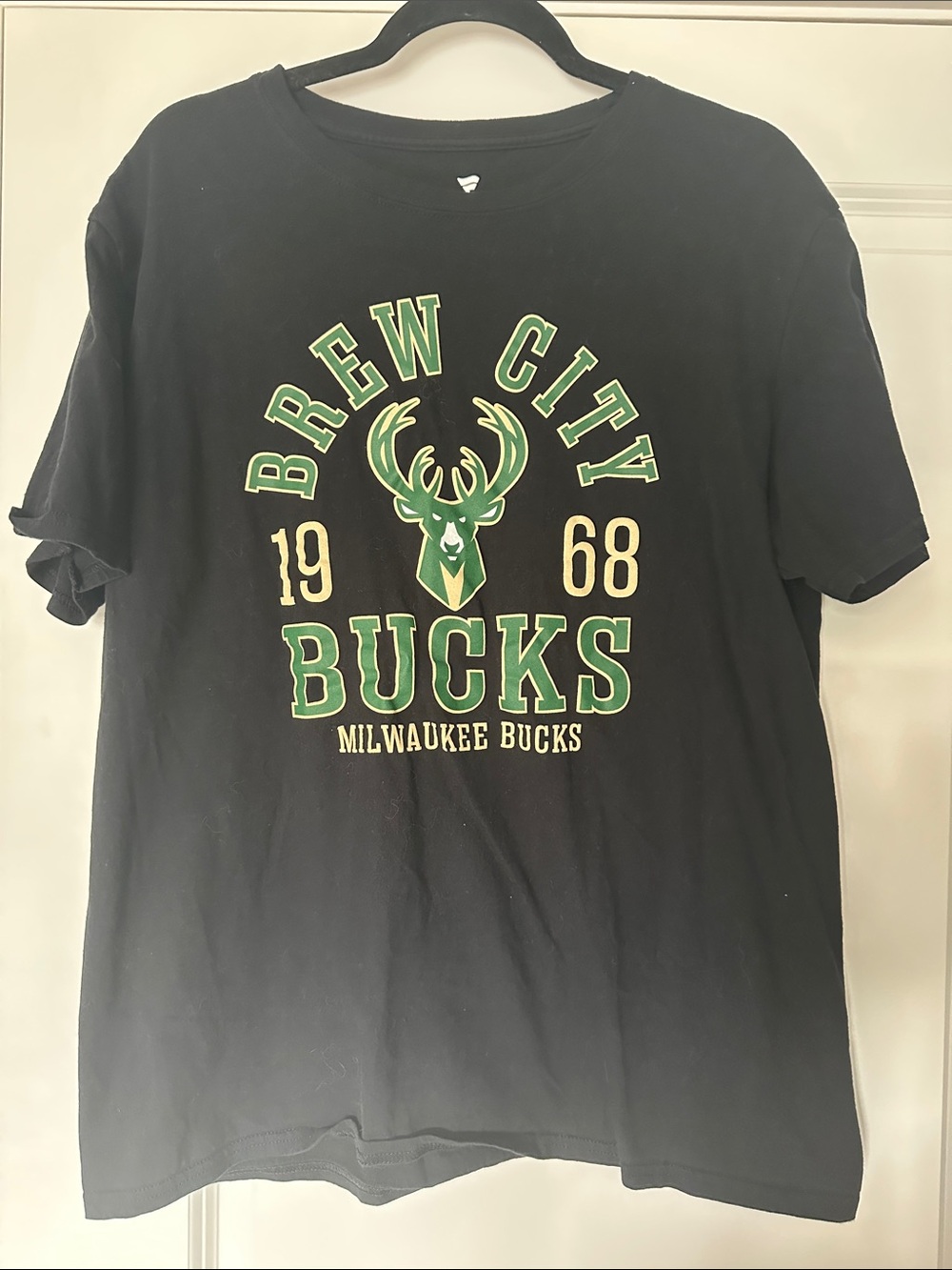 Fanatics Black Tee with Green and Gold Milwaukee Bucks Crest